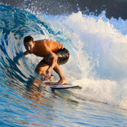 Person surfing on a wave in the ocean